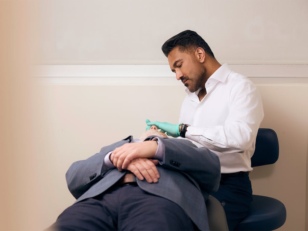 Doctor helping a patient
