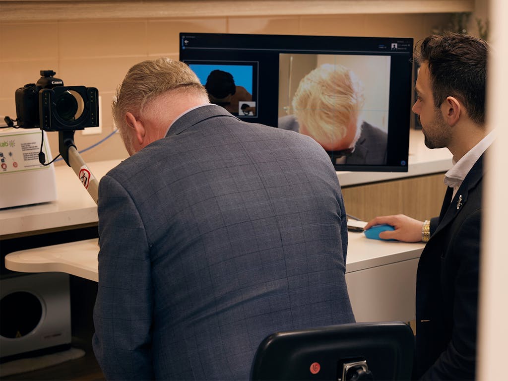 A man getting a photo taken of his hair