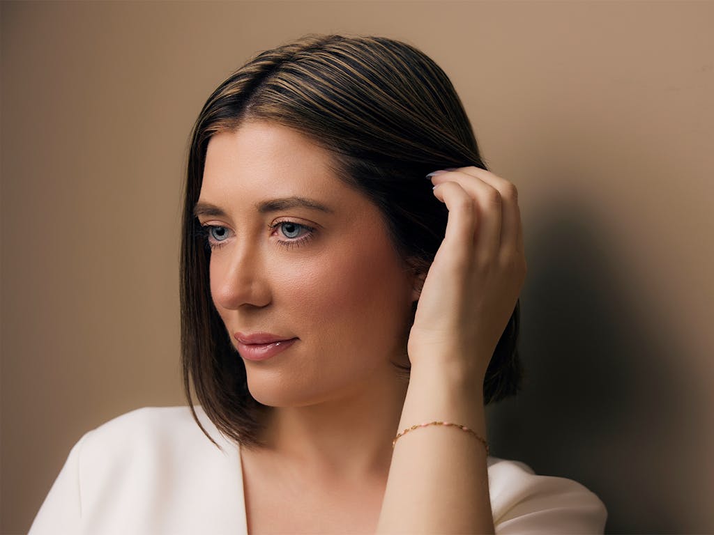 A Woman touching her hair