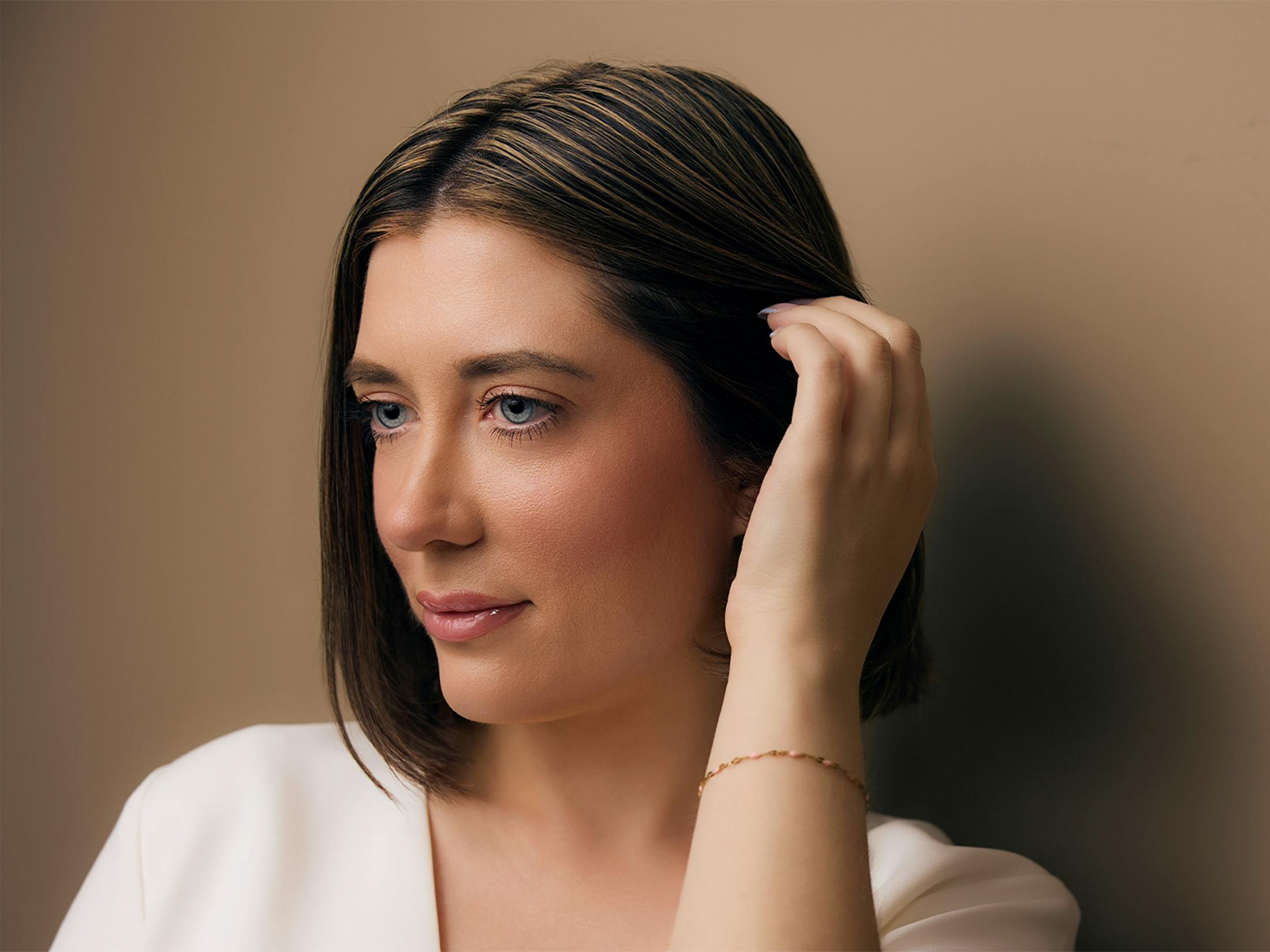 A Woman touching her hair