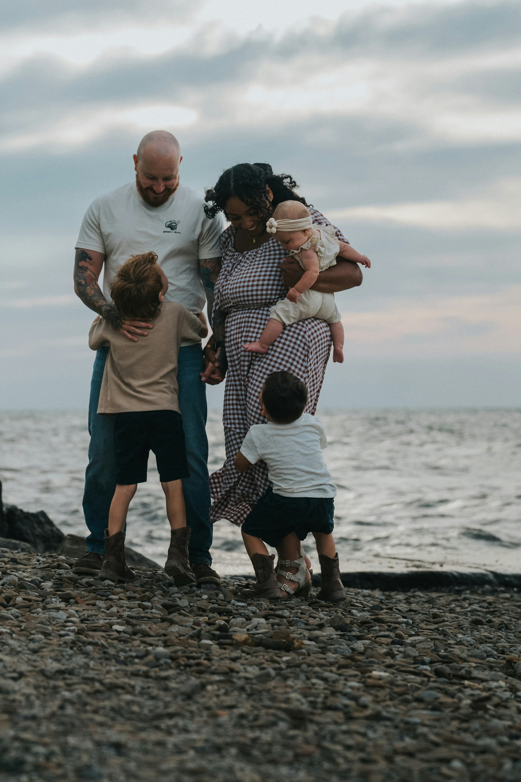 Family playing together at the water's edge at Veterans Memorial Park in Avon Lake, Ohio