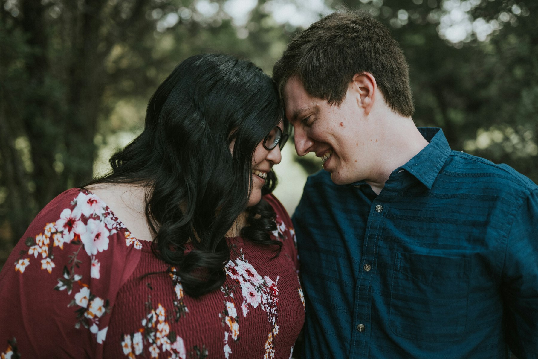 Parents forehead to forehead during a family session