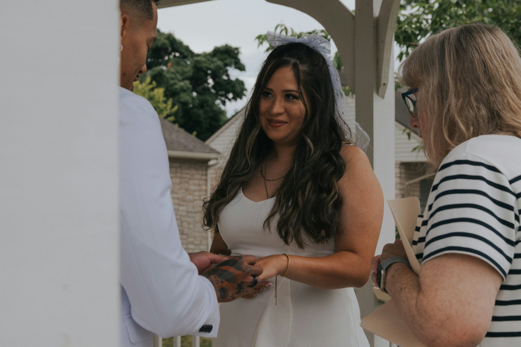 Bride during the vows with the officiant at a Veterans Memorial Park wedding in Avon Lake, Ohio