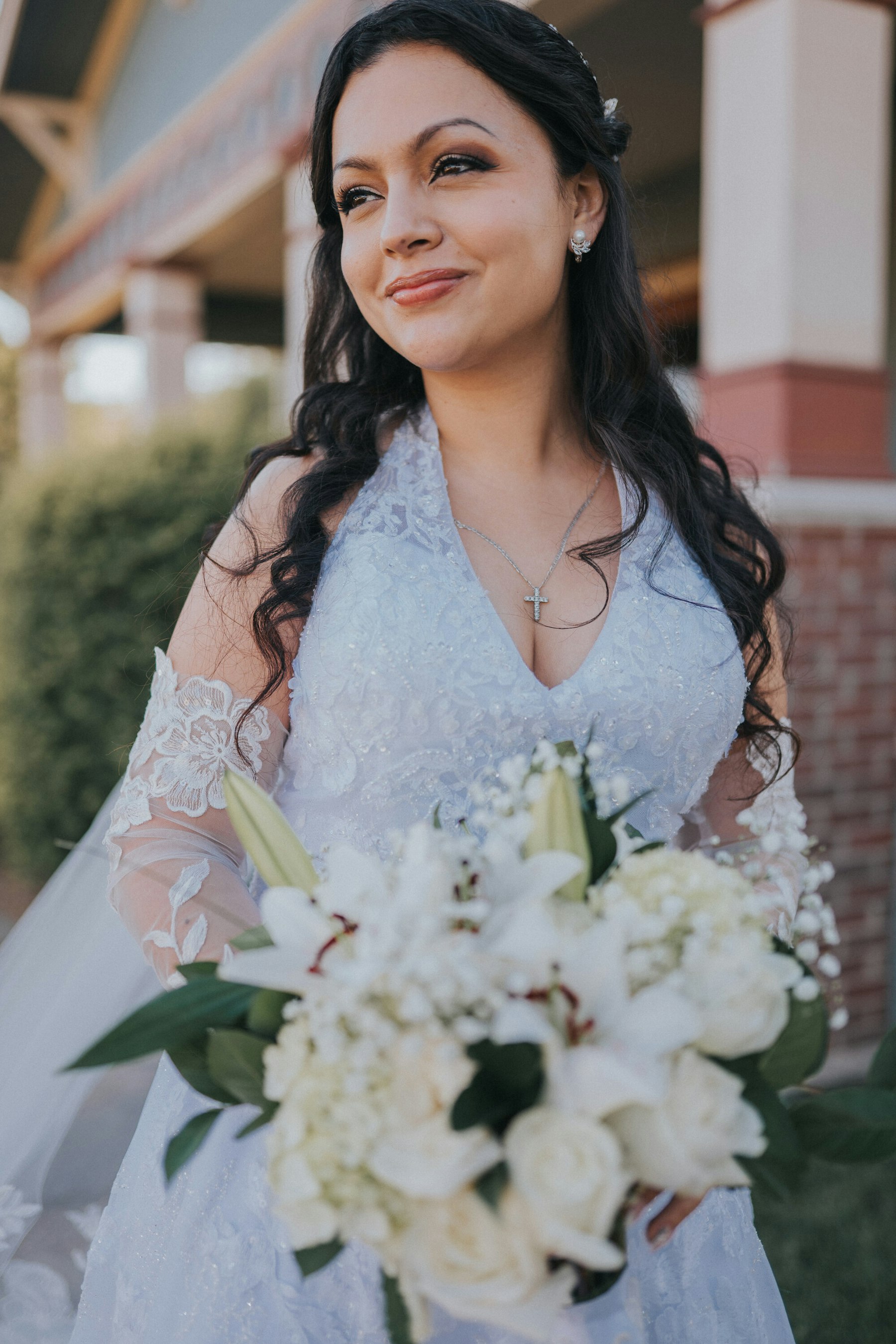 Bride portrait with a white bouquet at a garden wedding