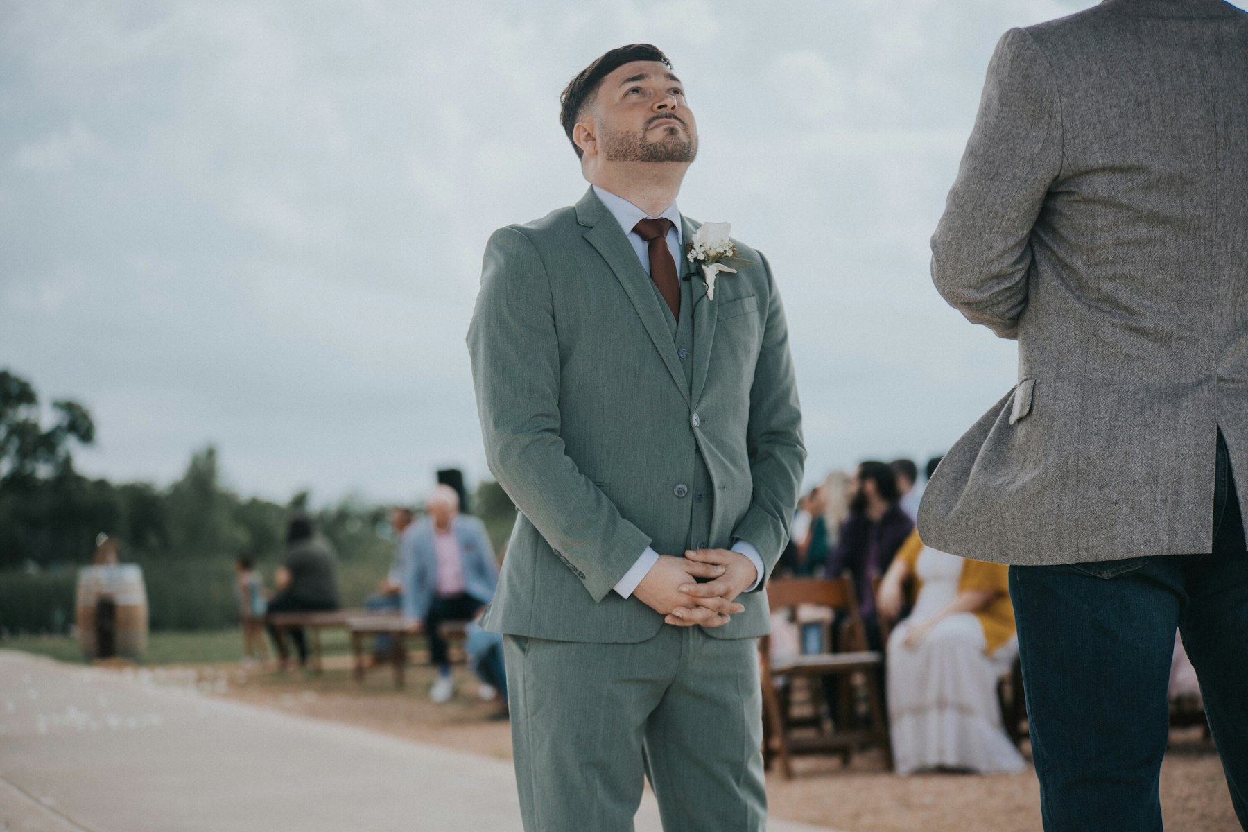 Groom's reaction as the bride walks in at a rustic barn wedding