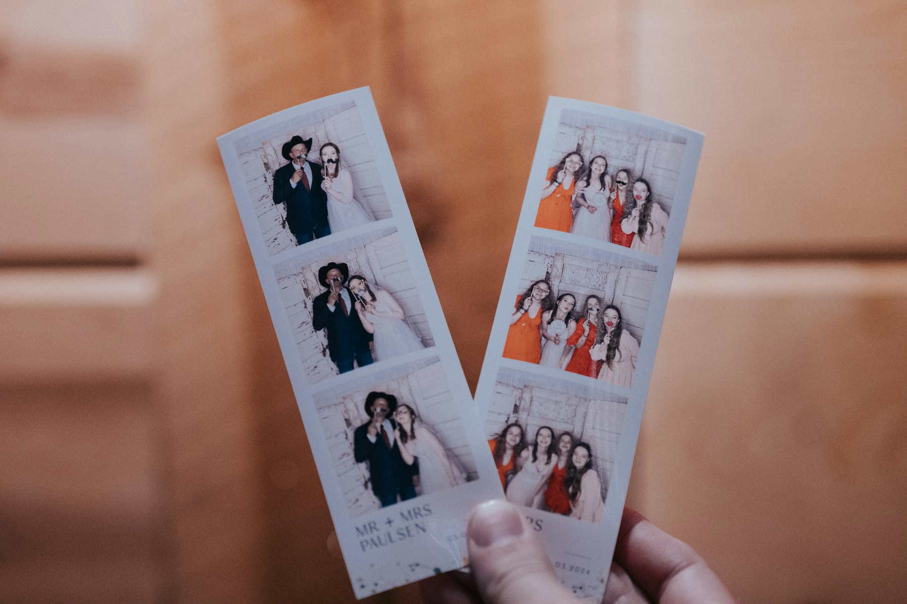 Photo booth strips at a rustic barn wedding