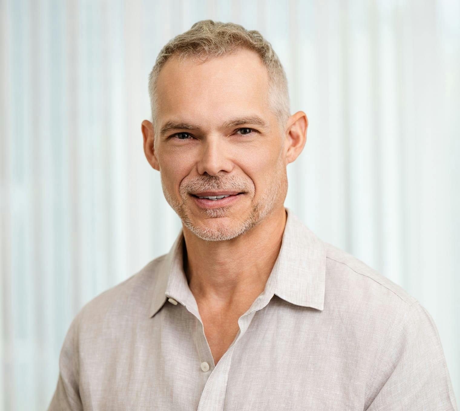 man wearing a grey button up shirt
