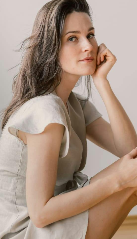 woman wearing a beige dress