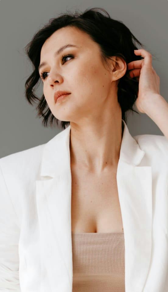 woman wearing a white suit jacket