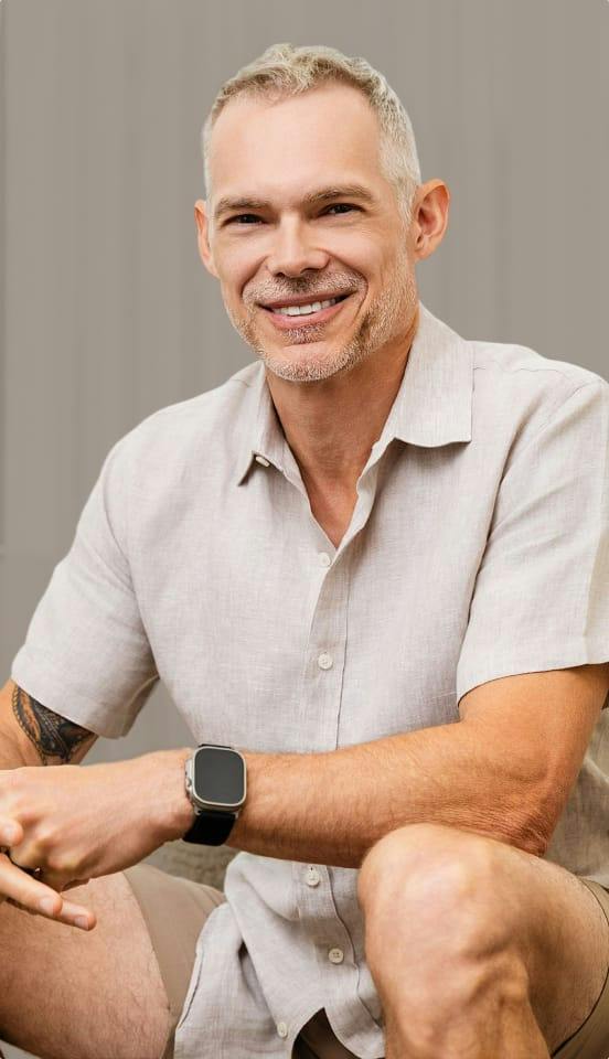 man in a grey button up shirt