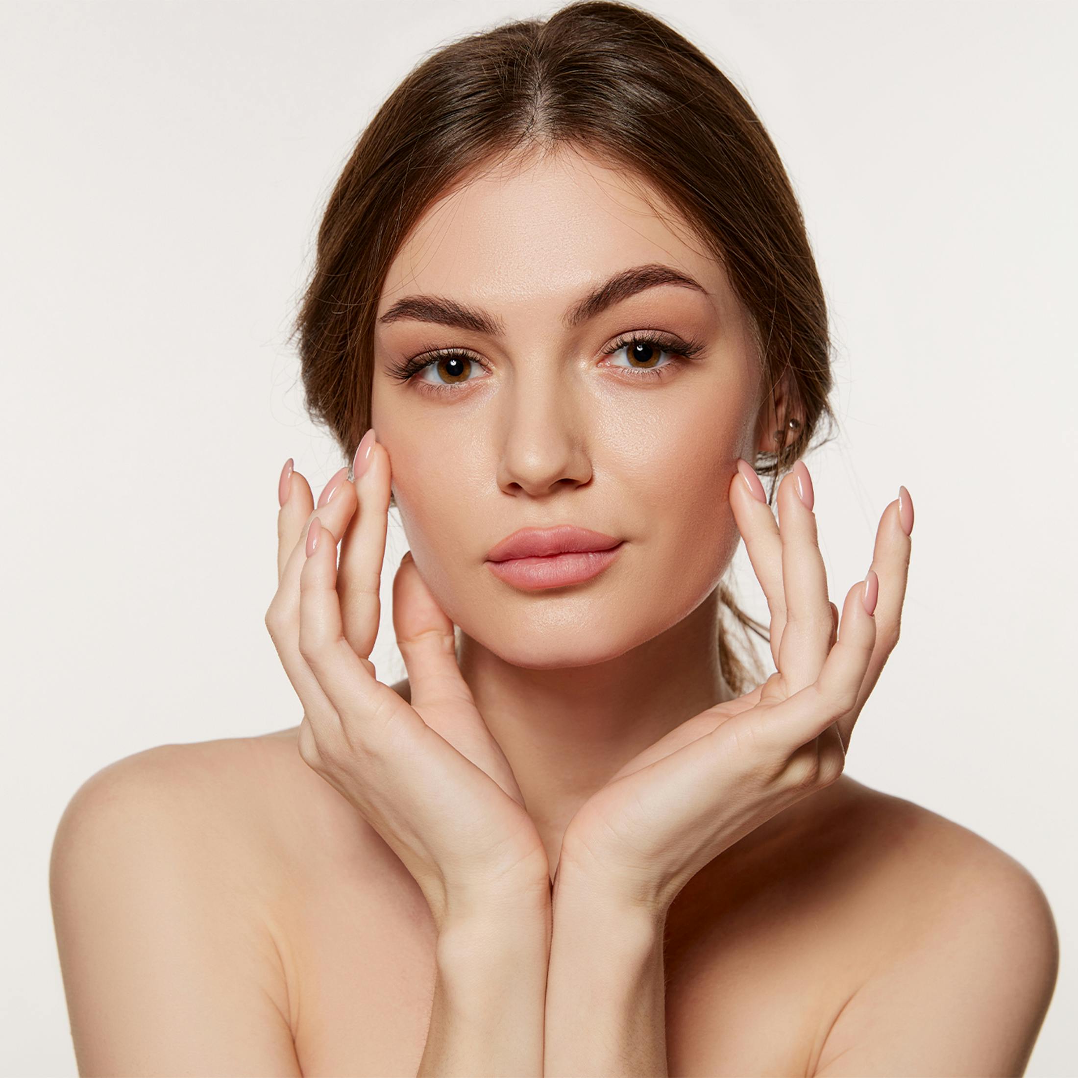 Woman touching her face