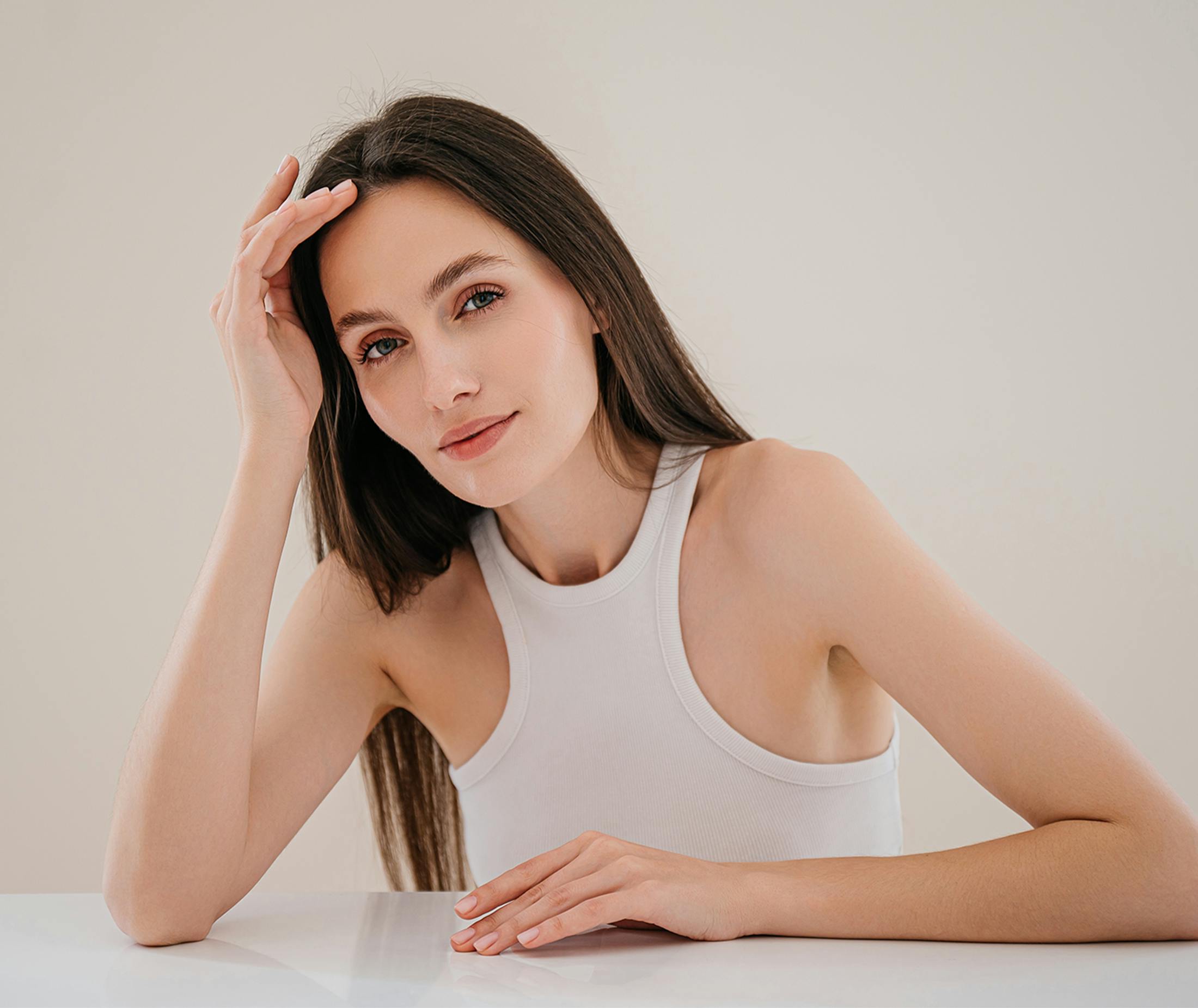 Woman touching her forehead