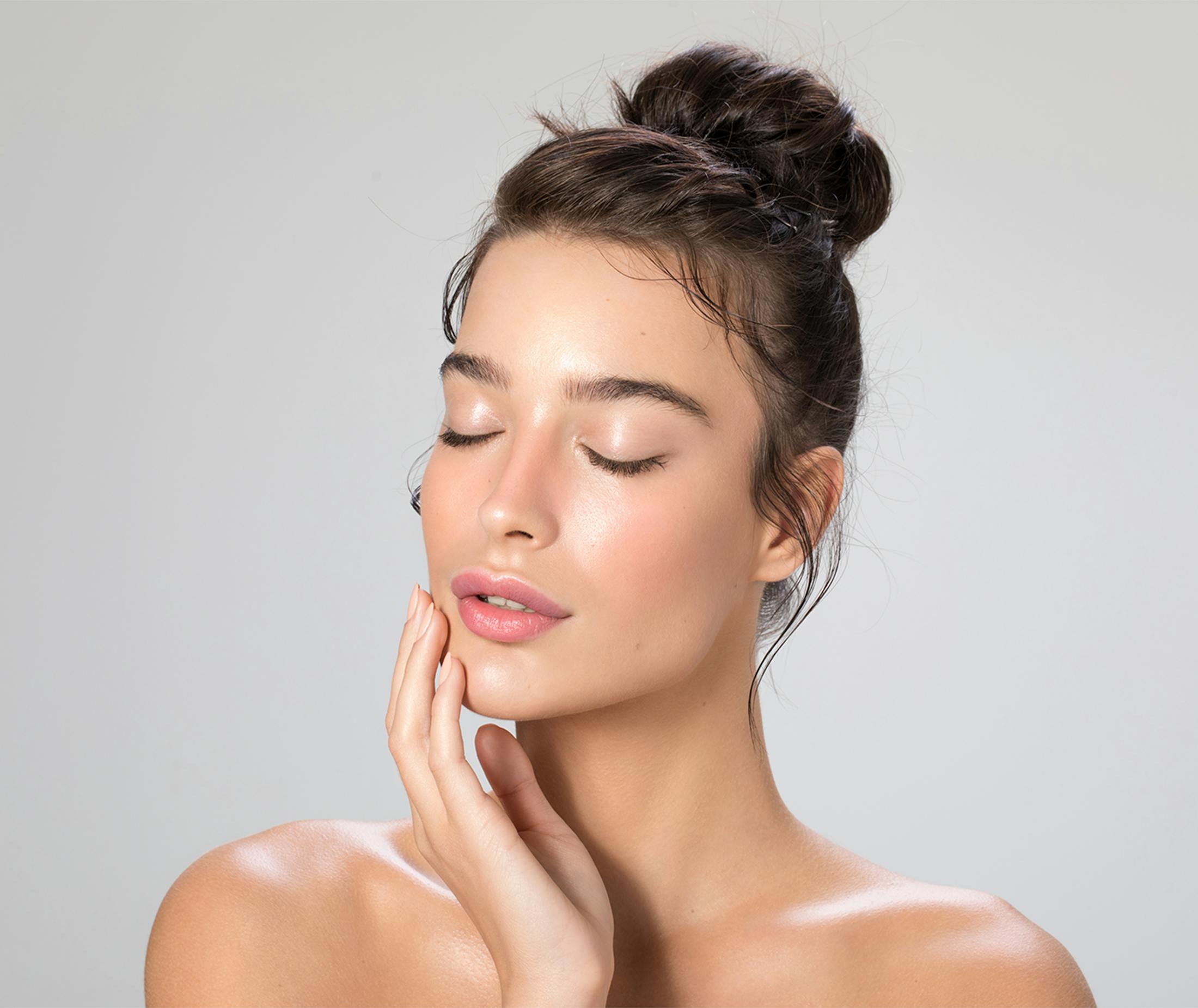 Woman touching her face
