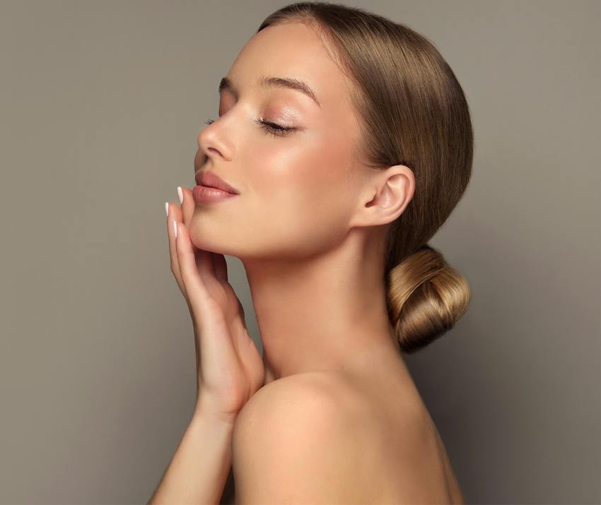 Woman touching her face