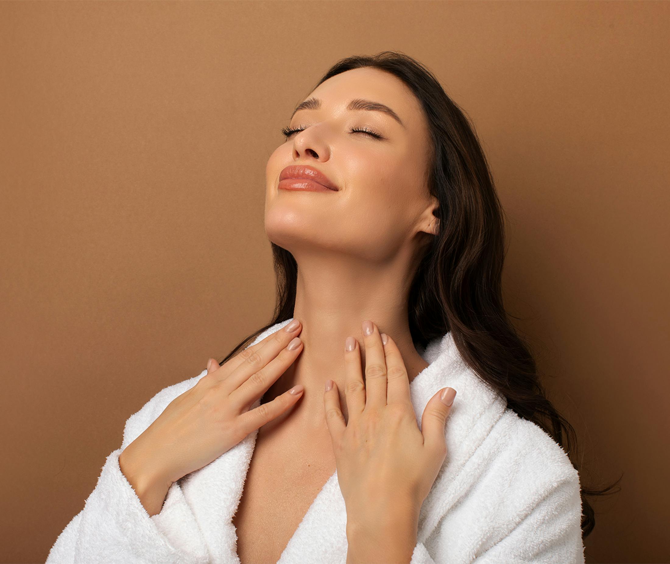 Woman touching her neck