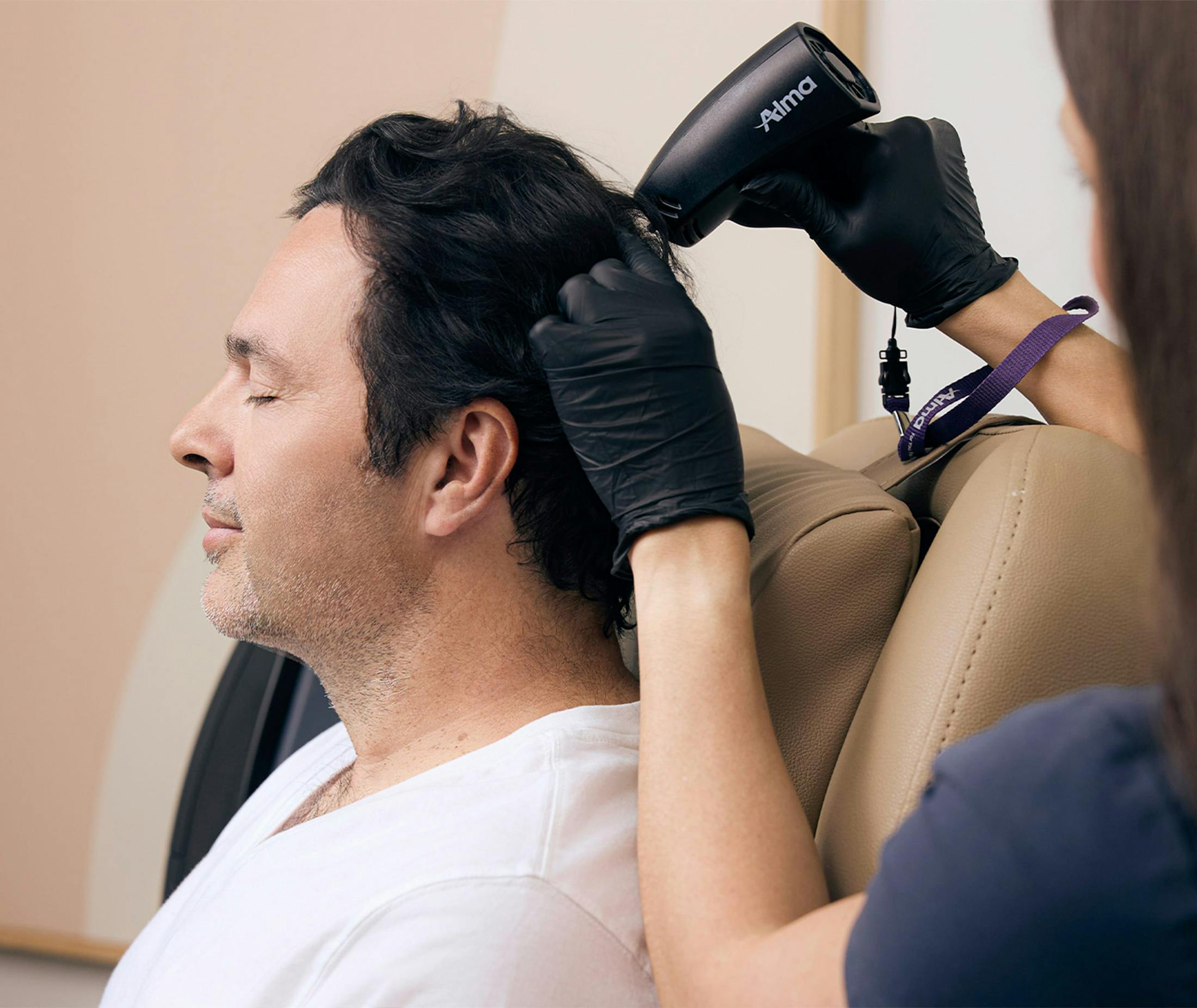 Man getting a hair procedure