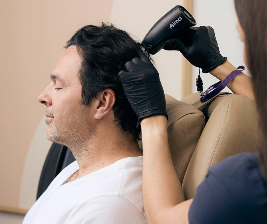 Man getting a hair procedure