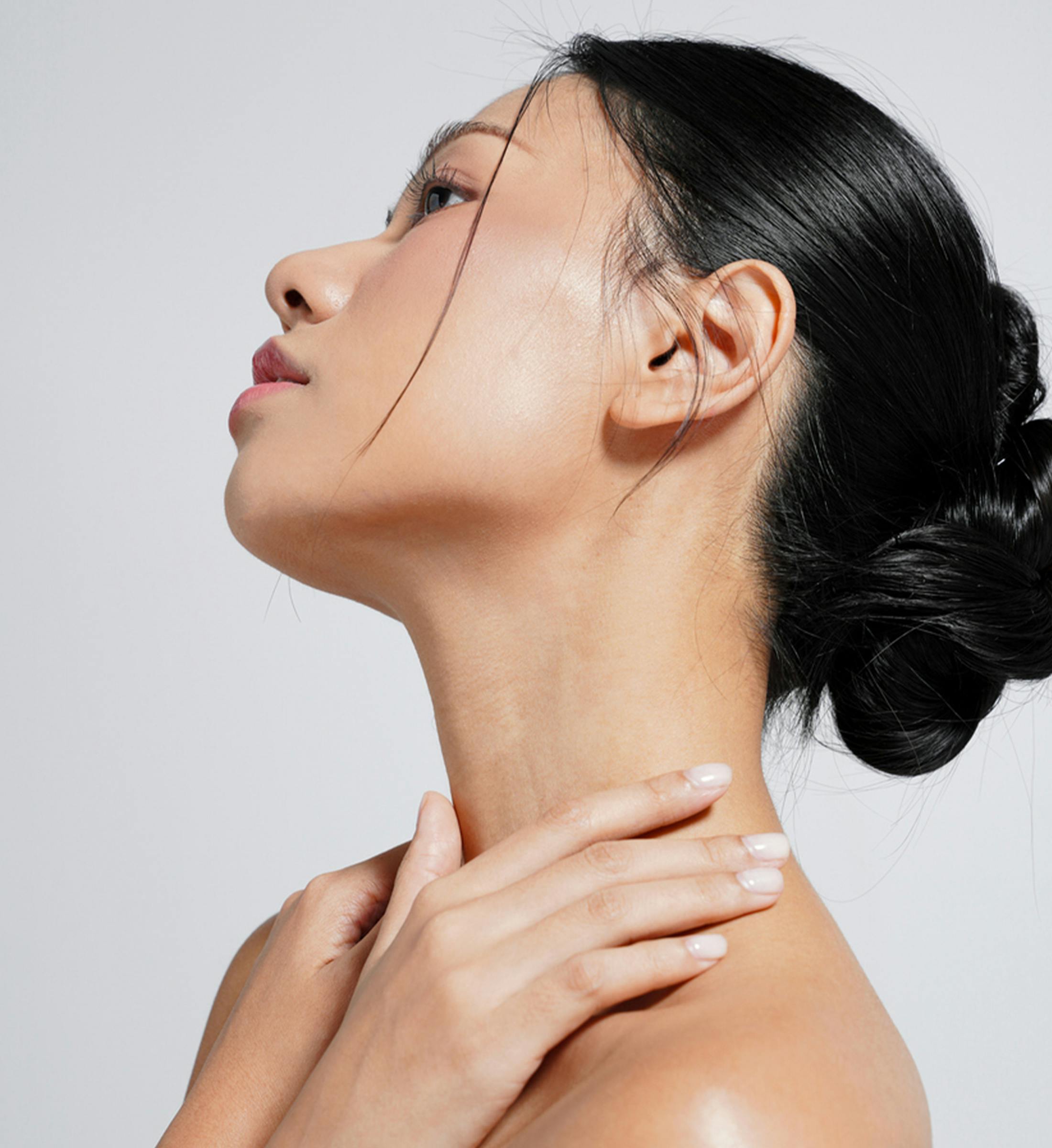 women holding her neck