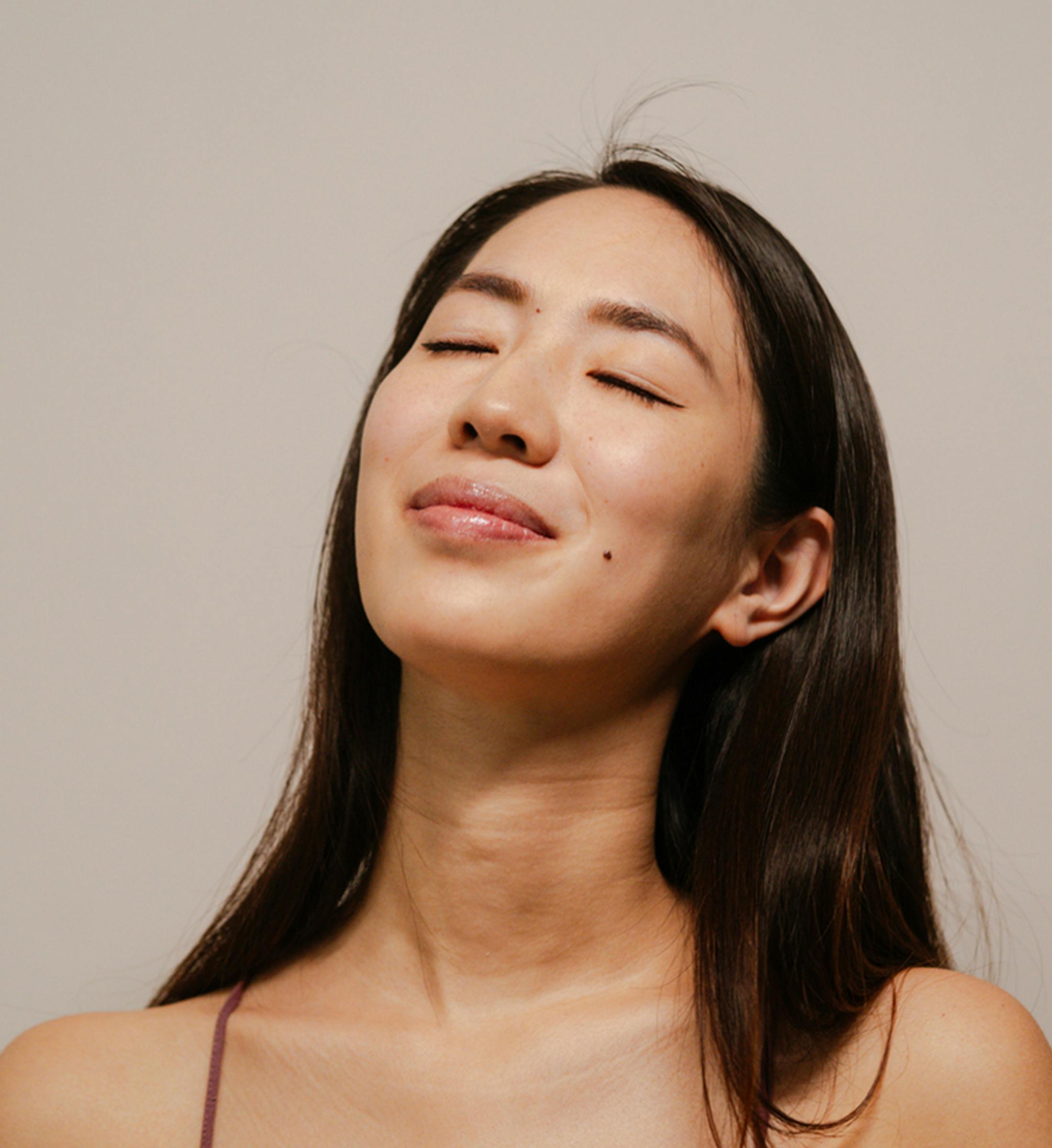 Woman with her eyes closed