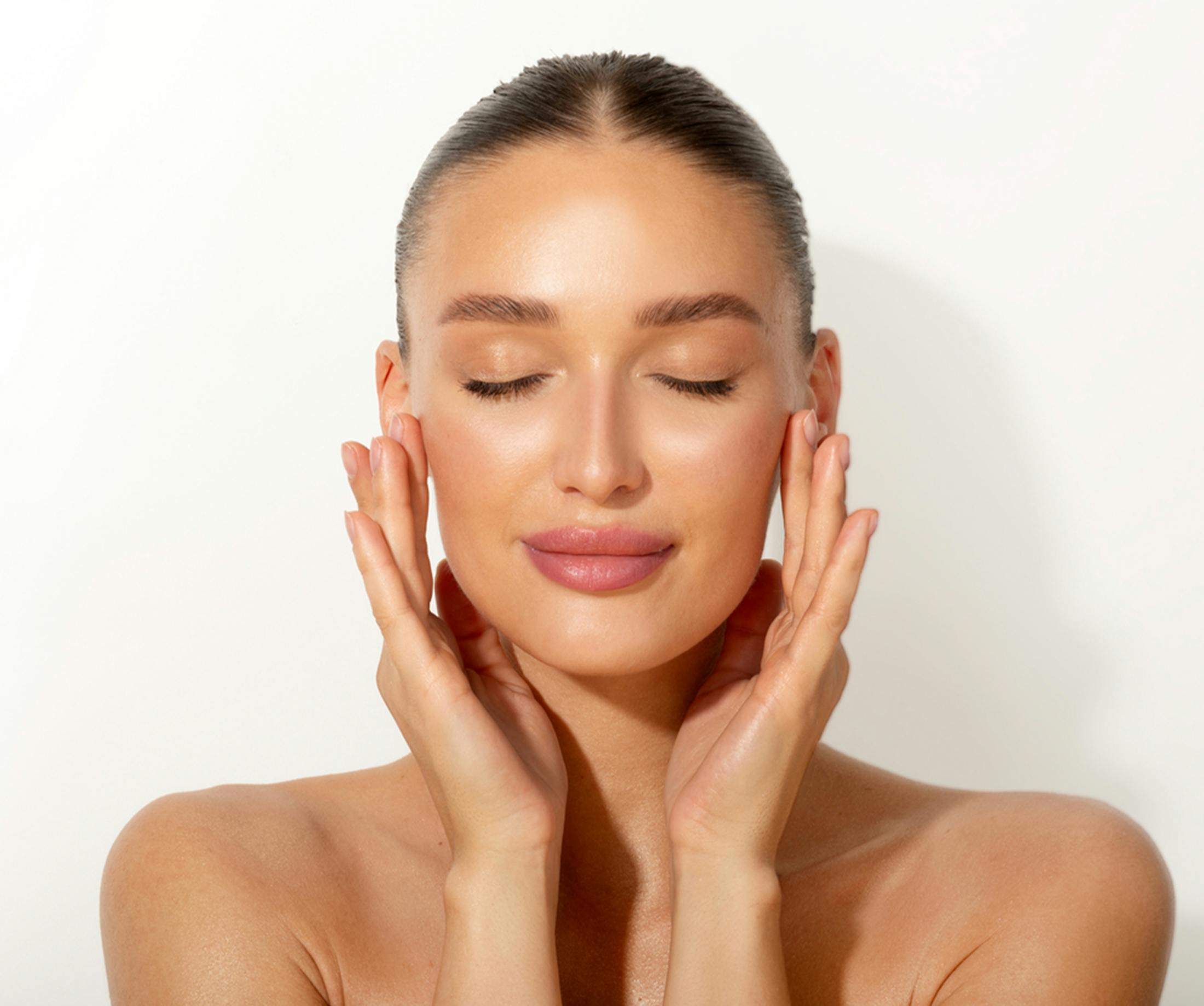 Woman touching her face