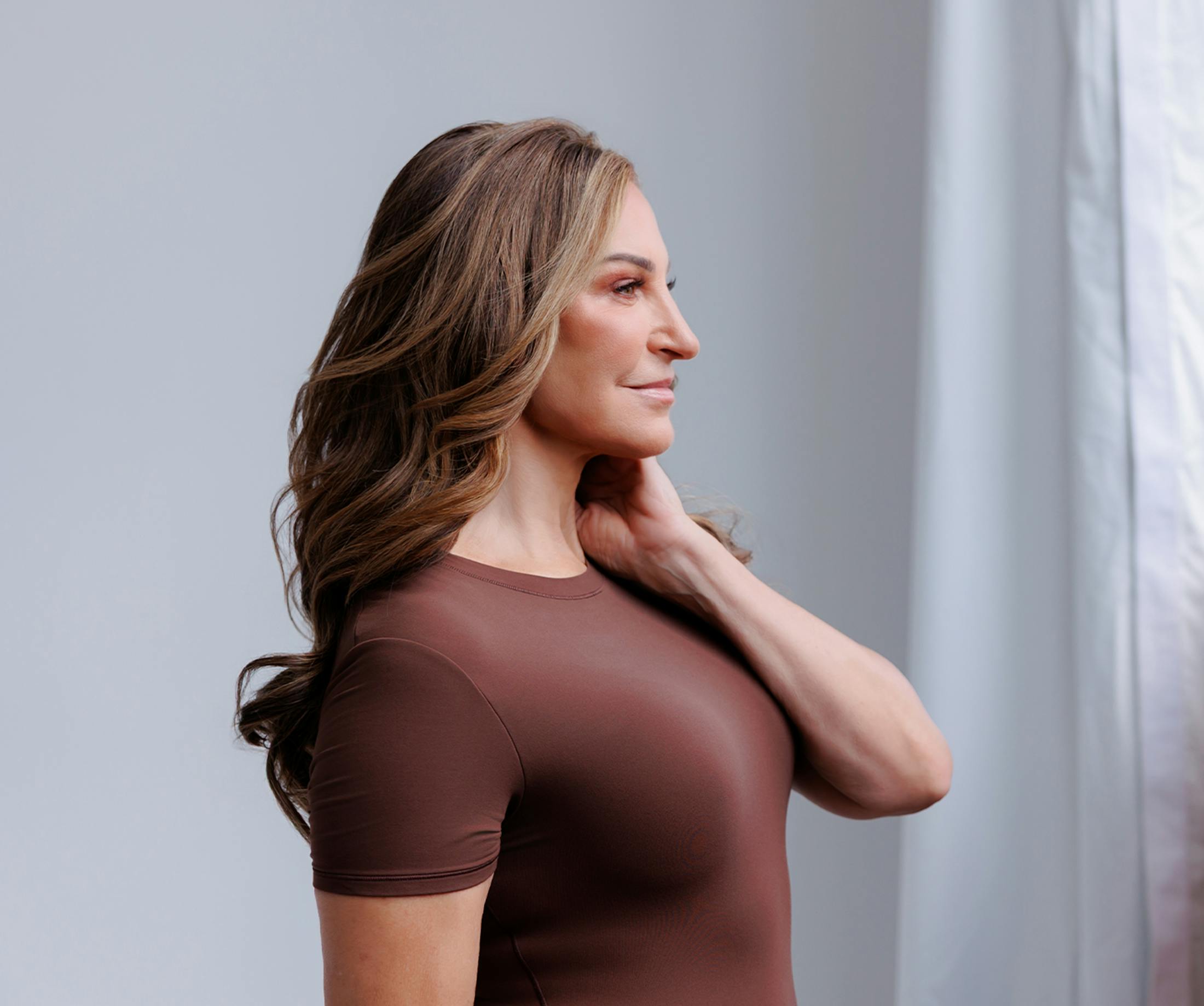 Woman holding her neck