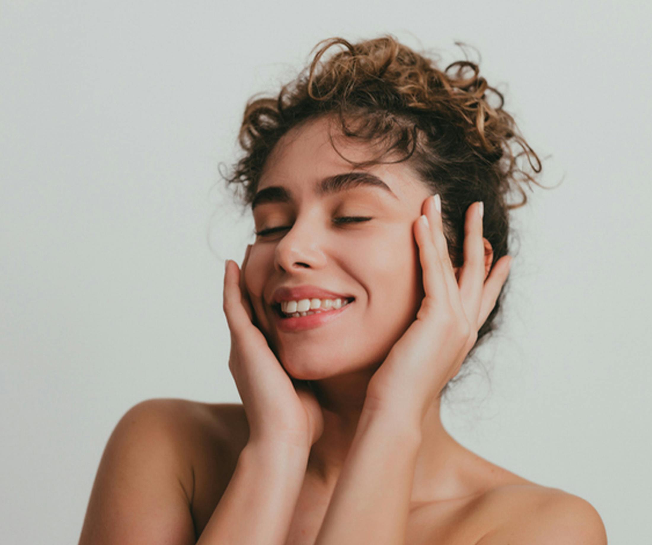 women holding her face