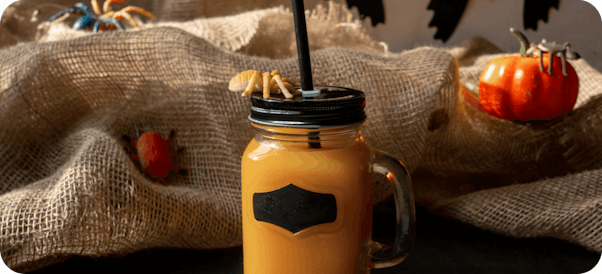 Autumn puampkin spiced latte in glass jar style mug