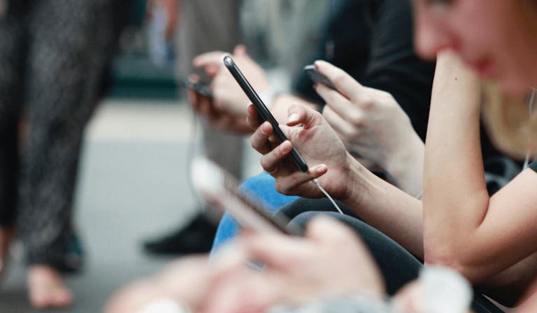 People looking at phones
