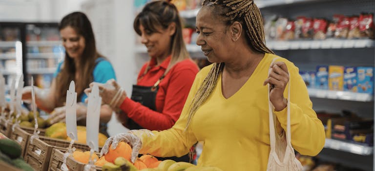 Woman buying fruit in the supermarket