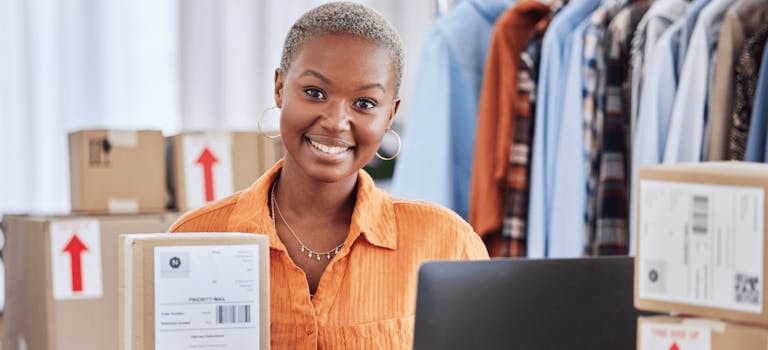 Woman surrounded by boxes for packaging