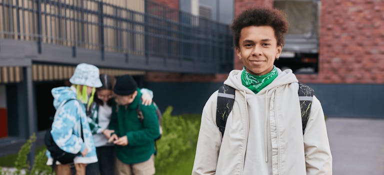 Teenage boy standing outside