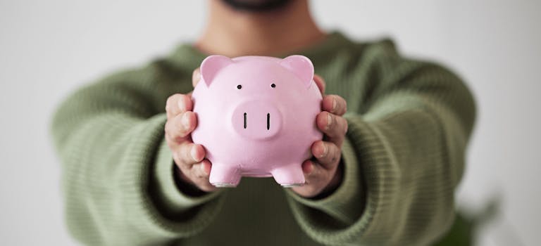 Man holding piggy bank
