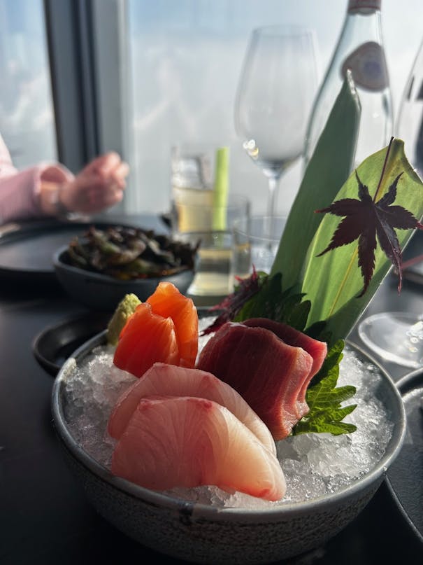 Brightly coloured sashimi presented on ice