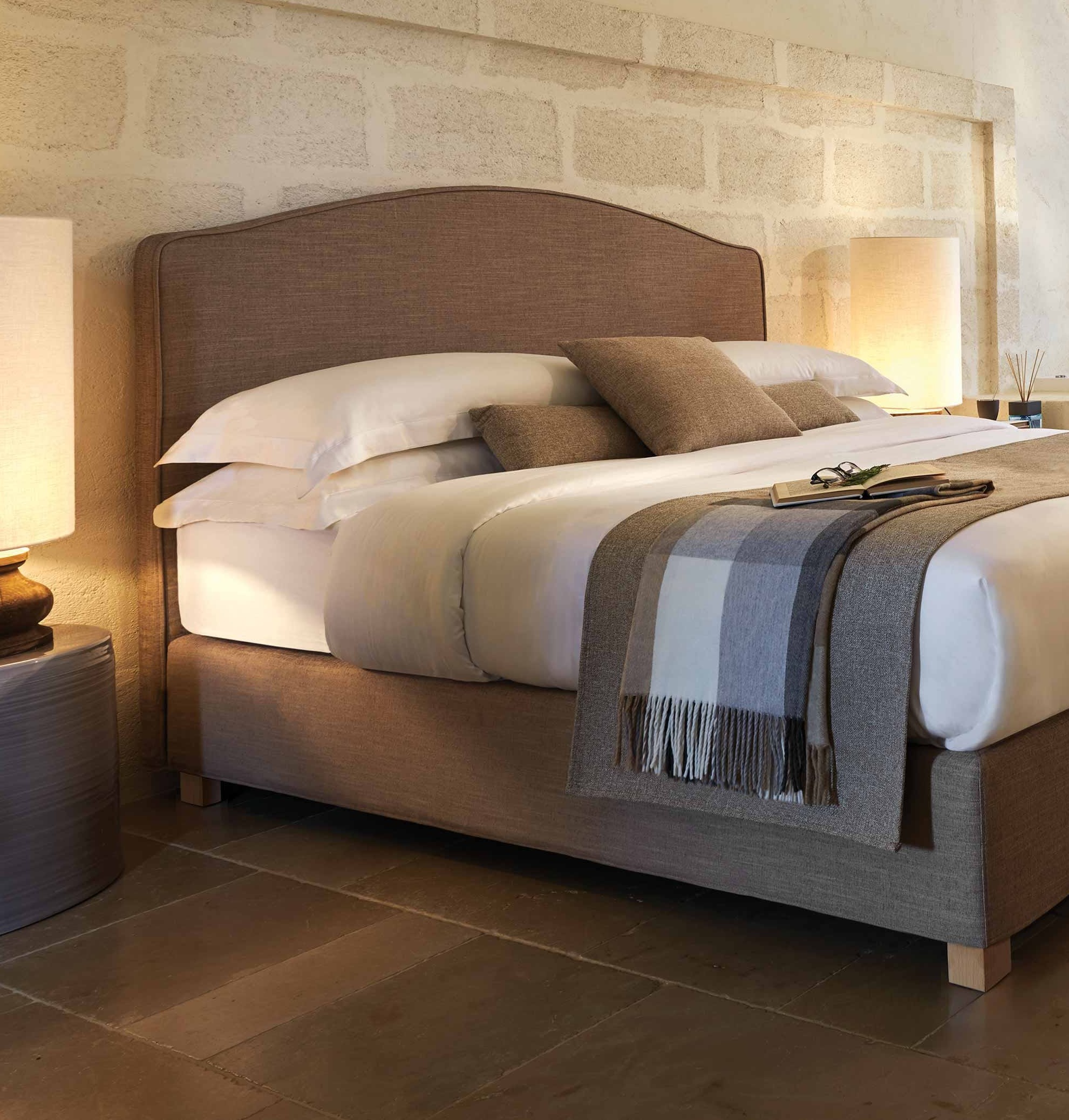 Bed with upholstered bed base in a classic-style room