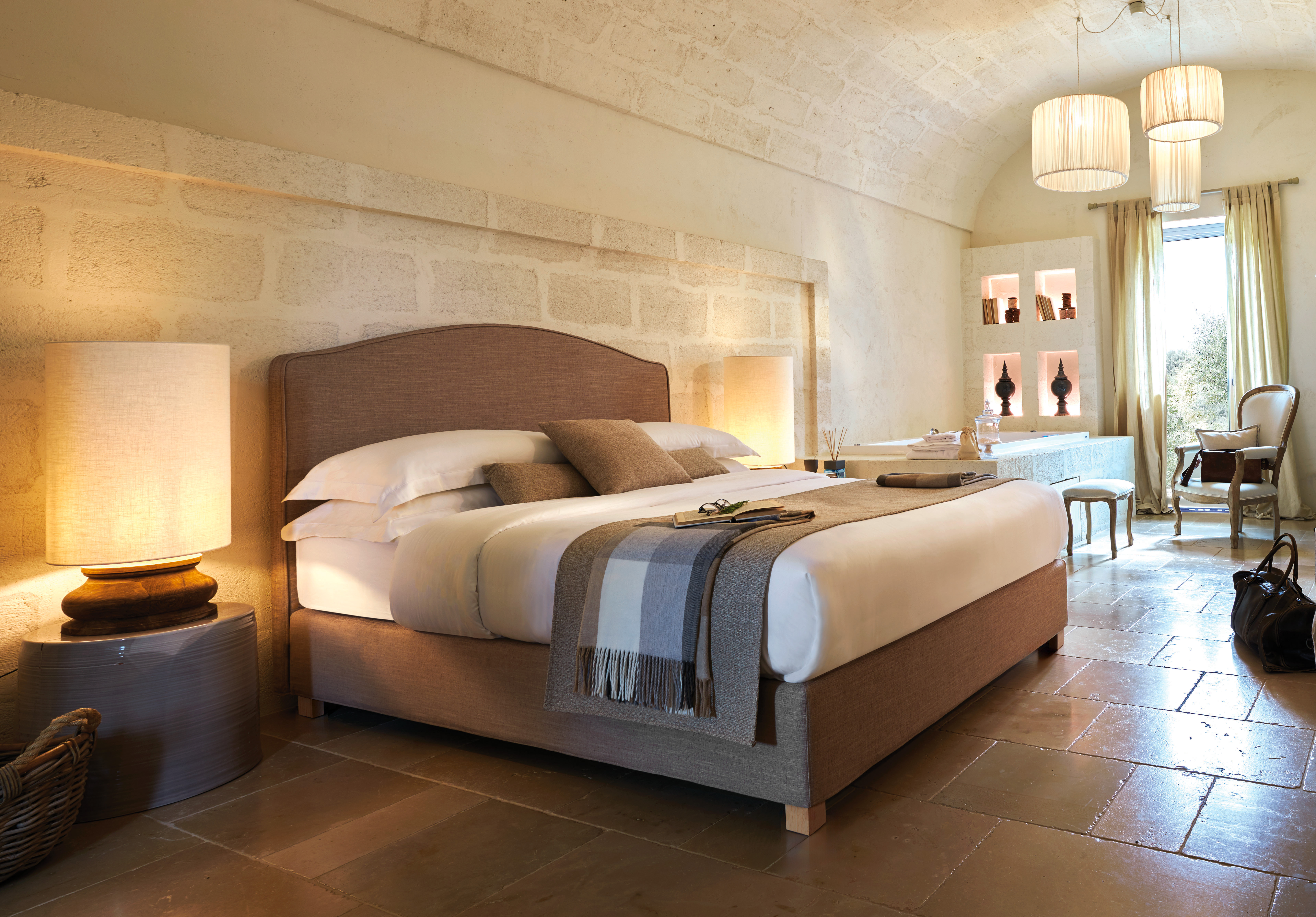 Hotel room with double bed in a contemporary setting