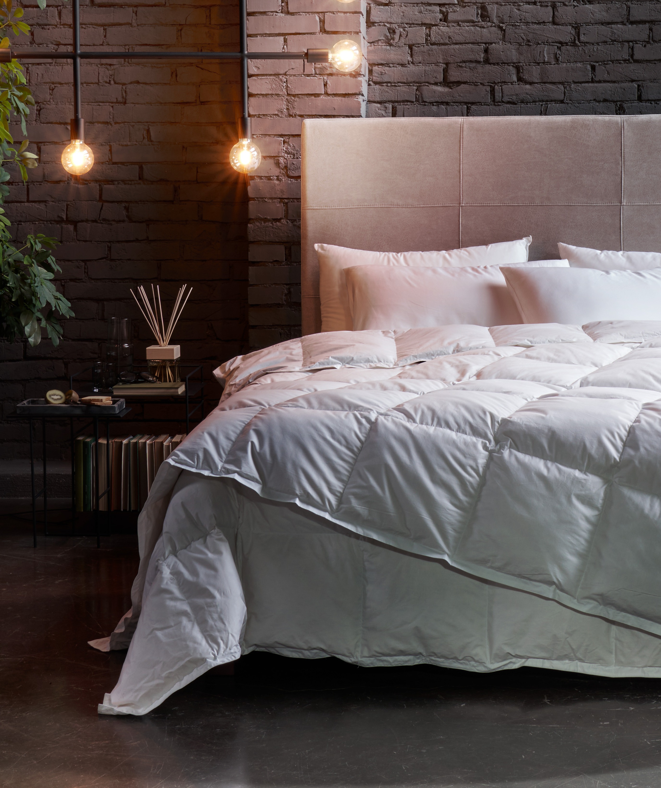 Double bed with white duvet in a contemporary setting