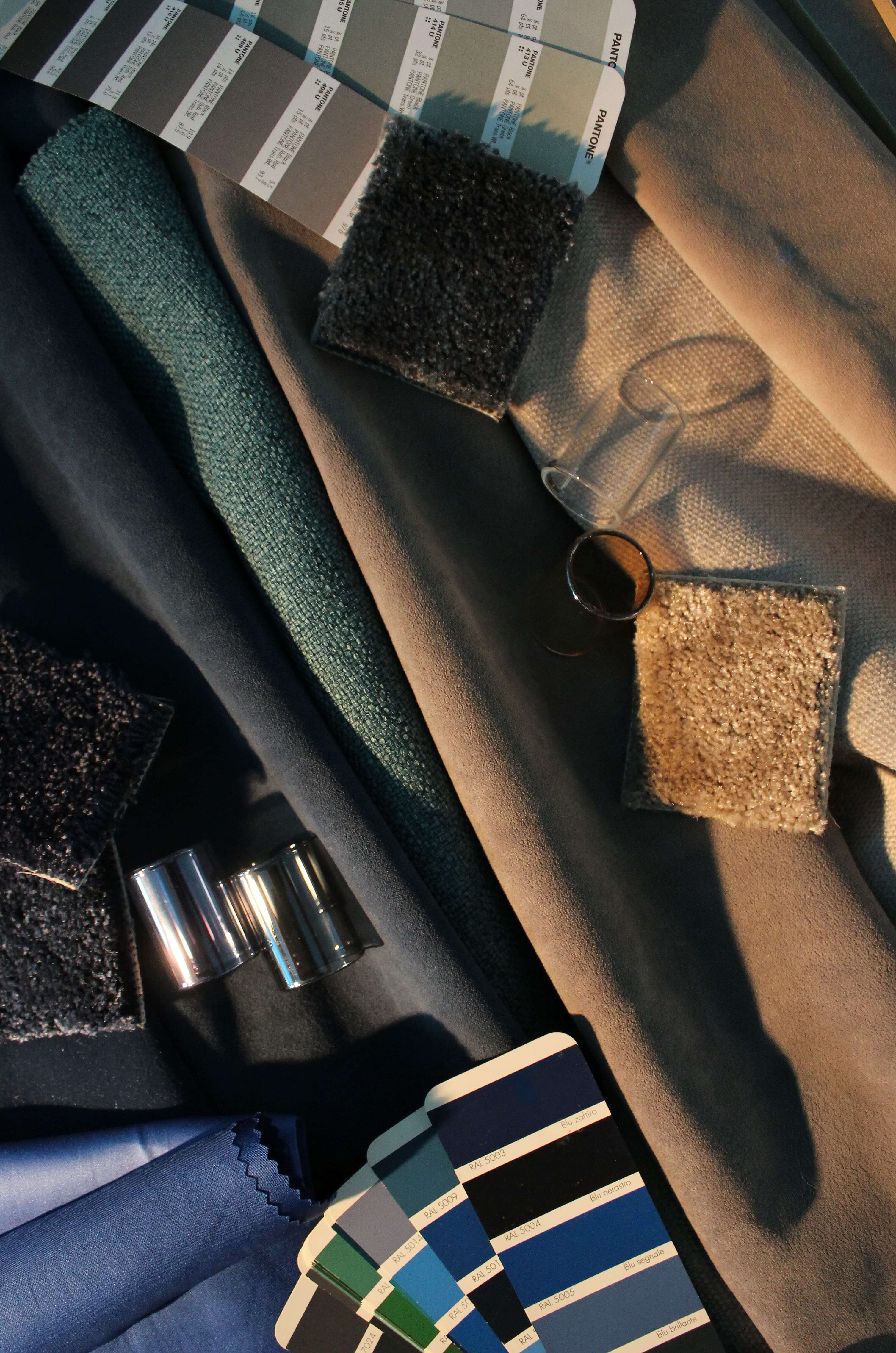 glass samples, fabric swatches and Pantone colour guides