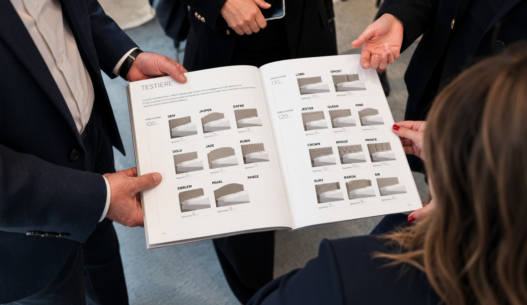people browsing the Dorelan catalogue at a trade fair
