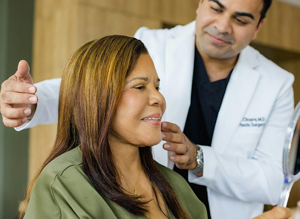 Dr. Chopra about to point to patient's jaw