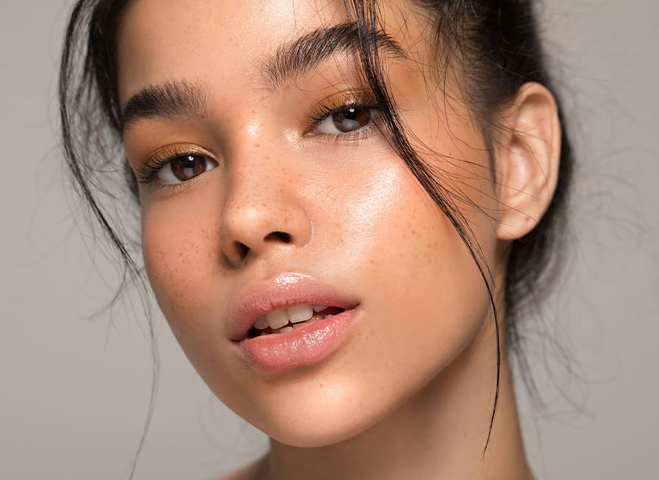 close up of woman with little pieces of hair in the front of her head