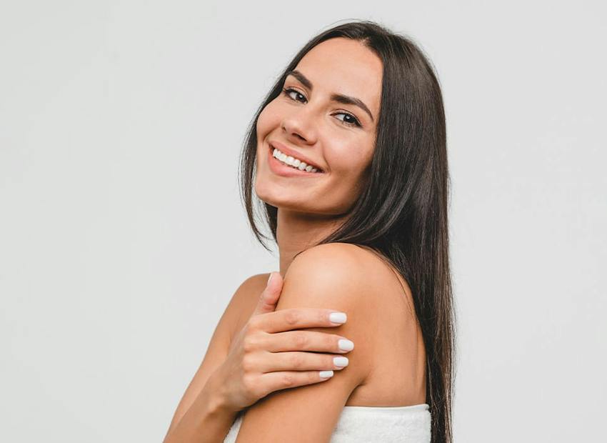 woman touching her arm