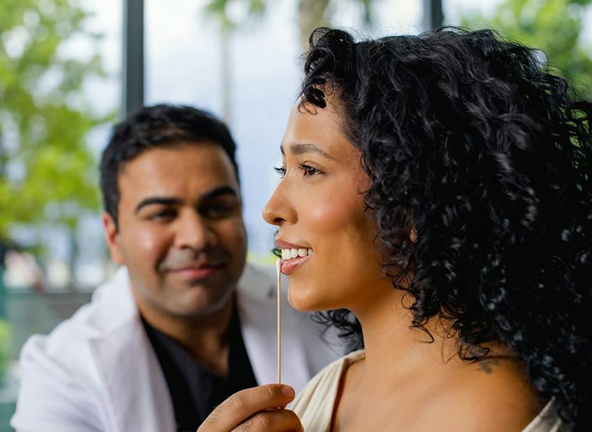 Dr. Chopra looking at patient's lips