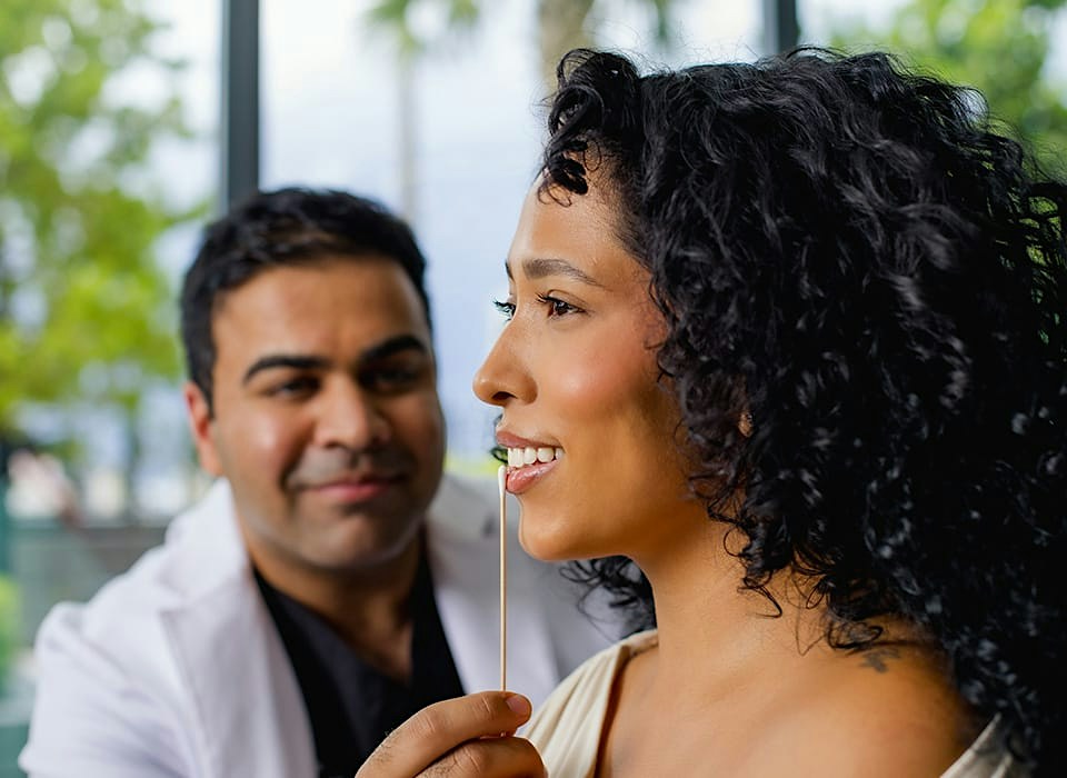 Dr. Chopra looking at patient's lips