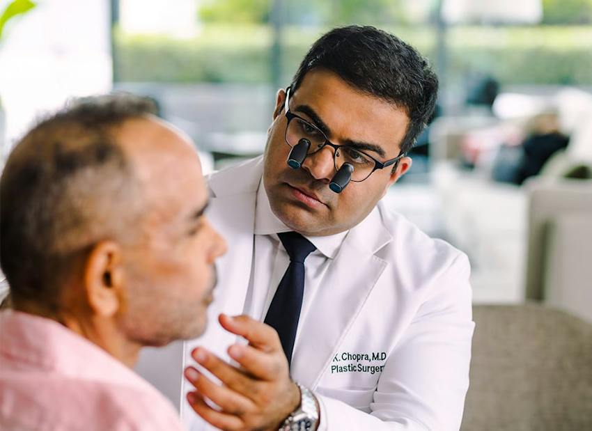 Dr. Chopra examining patient
