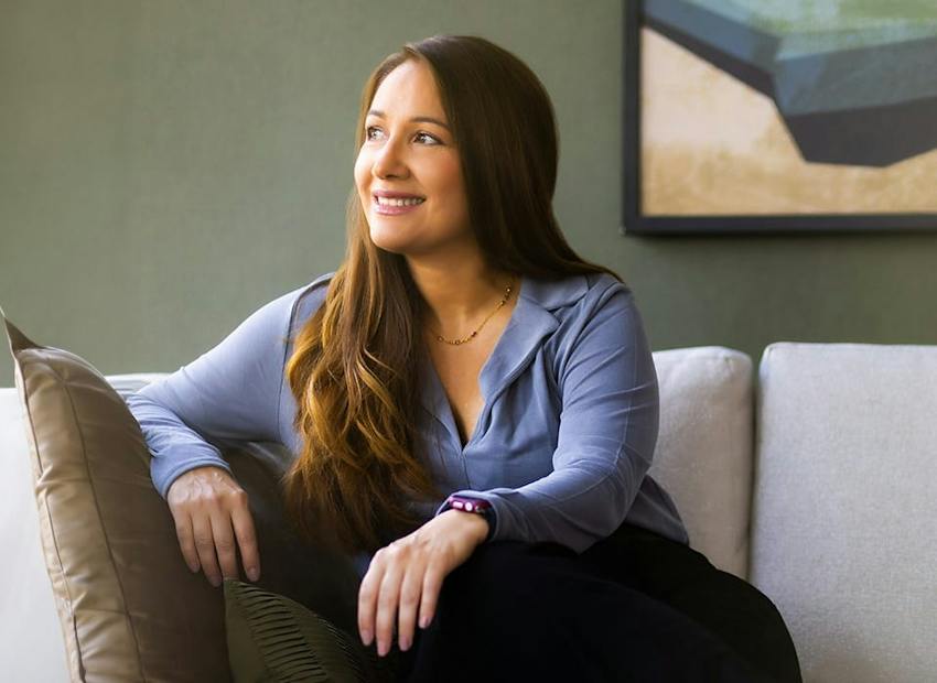 woman sitting on couch