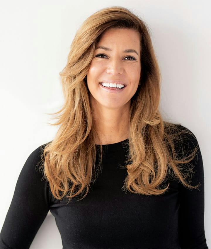 woman in black long sleeve smiling