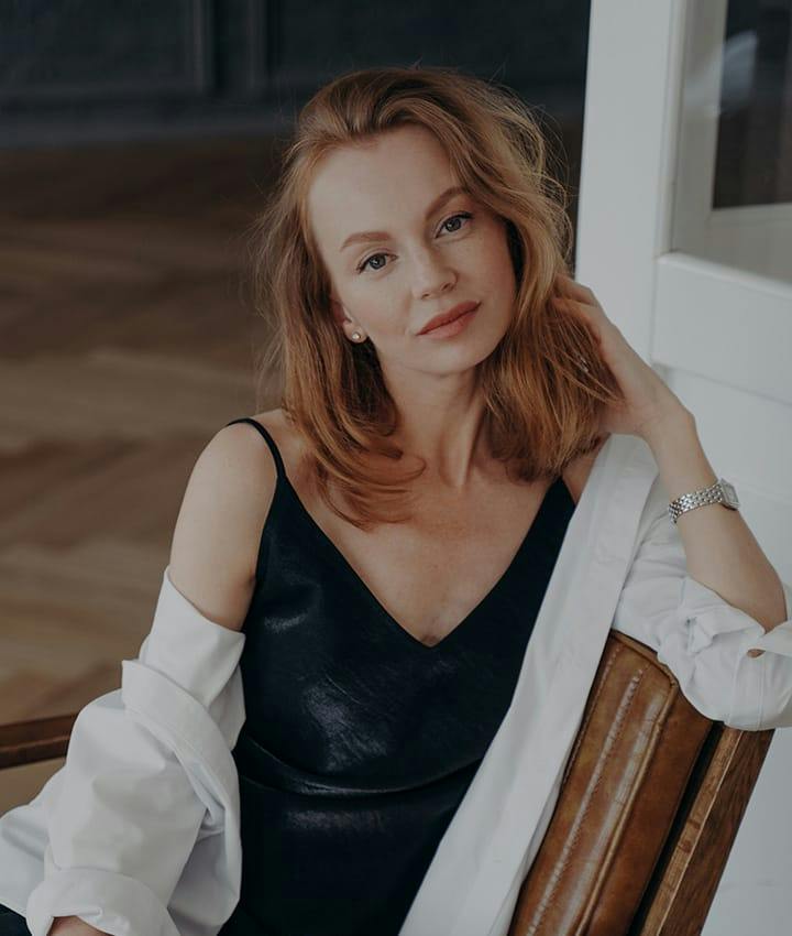 woman sitting in chair posing