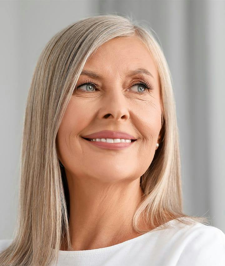 woman smiling and looking to the right