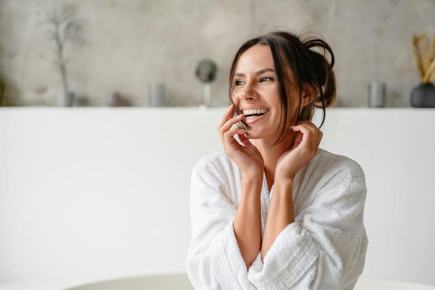 Woman laughing while speaking on phone