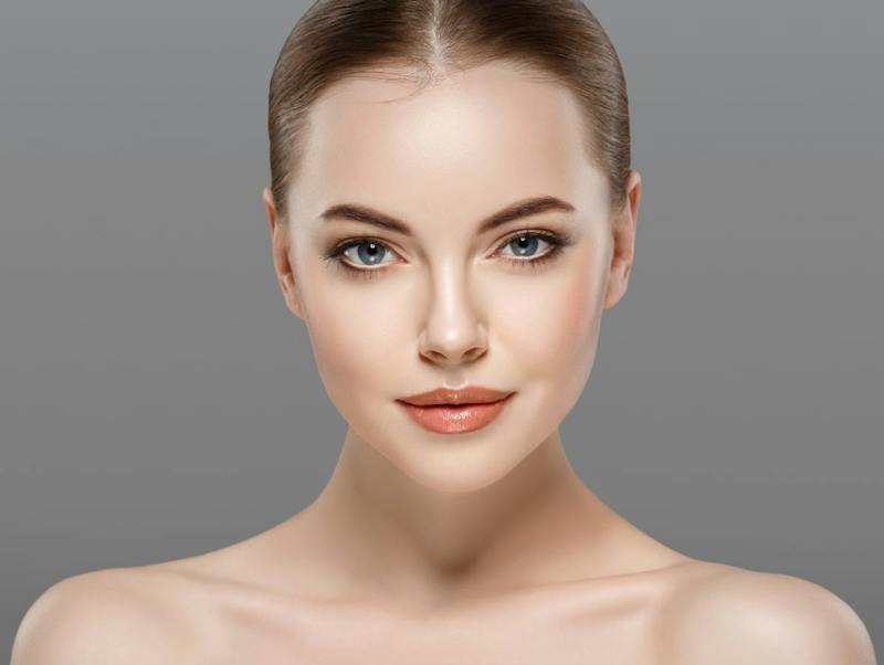 Close-up of beautiful woman with symmetrical face